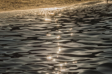 Sea background at sunset ,reflection of sunlight as stars.