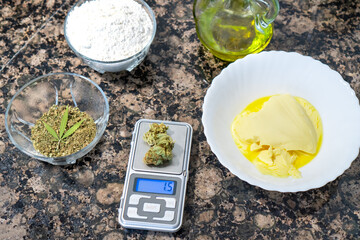 Cooking with cannabis: view of digital scale to calculate the dose of marijuana and other...
