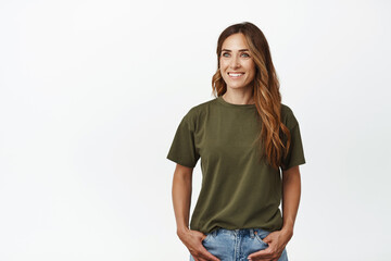 Smiling adult caucasian woman with long hair, white smile, looking aside with happy face...