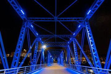View of the Grand Rapids blue bridge from the river at night - Michigan - USA