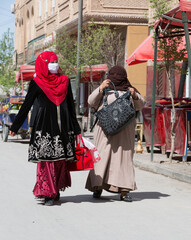 Chineses Uighur veiled women in the street in Kashgar, Xinjiang, China