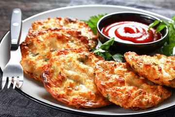Cheesy Chicken Fritters on a plate, top view