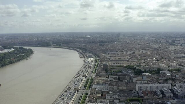 The beautiful french city Bordeaux on a warm and sunny summer day. The city is the center of the famous wine growing region. Drone Aerial views of the famous cityscape and the river Garonne.