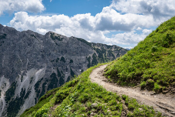 Winding hiking path in alps
