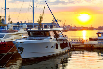 Private sailing yachts are moored in the sea at the pier.