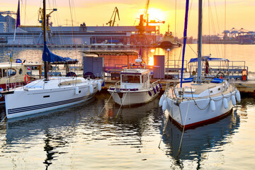Anchorage with sailing yachts on the sea in the yacht club against the backdrop of the evening sky...