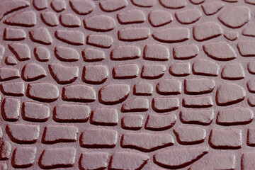 Macro image of a brown leather surface.