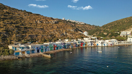 Fototapeta na wymiar Aerial drone photo of picturesque seaside village of Klima and traditional fishermen settlement with colourful boat garages called syrmata in island of Milos, Cyclades, Greece