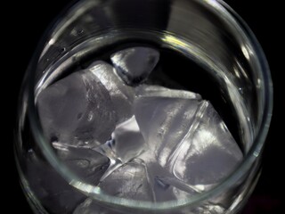 glass with ice, pieces of ice