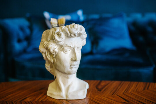 White plaster bust in close-up interior