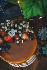 Caramel drip cake with fresh flowers