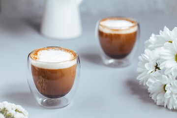 Cups of coffee on a rustic wooden background