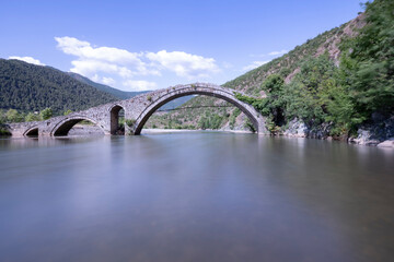 Fototapeta na wymiar old stone bridge in ancient roman road over the Shkumbin river 