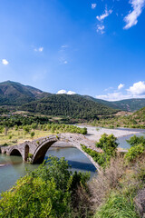 old stone bridge in ancient roman road over the Shkumbin river 