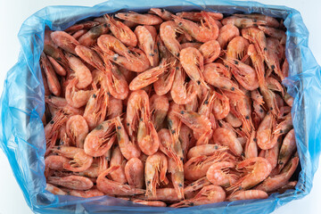 Frozen shrimp in a cardboard box. For wholesale.
