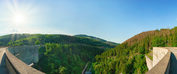 Fototapeta na wymiar Panorama view of a dam in Germany in summer with blue sky an