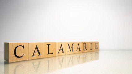 The name Calamarie was created from wooden letter cubes. Seafood and food.