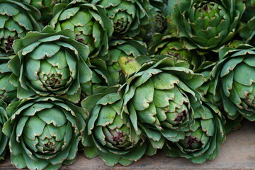 Green and purple artichokes at a French farmers market