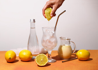 Creamy lemonade trendy summer mocktail. Cold non-alcoholic cocktail with lemon juice and sweetened condensed milk. Ingredients for prepare beverage.