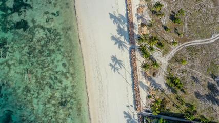 Aerial top view on sandy beach Jambiani town, Zanzibar