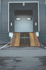 Industrial loading dock and ramp for a large warehouse. gate for loading cargo. Gate number 2