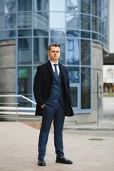 Fashion shot of a handsome young man in elegant classic suit. Men's beauty, fashion.