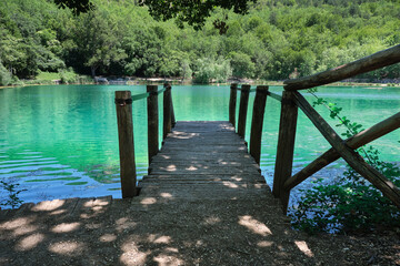 wooden pier on the lake of sinizzo abruzzo