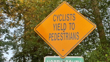 sign on the road Cyclist yelled to pedestrians  