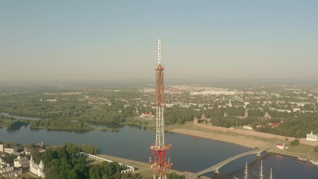 Aerial orbiting shot of a telecom tower or mobile mast