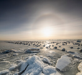 Winter coast of Estonia. Halo in the sky.