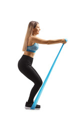 Fototapeta na wymiar Young woman exercising with an elastic rubber band