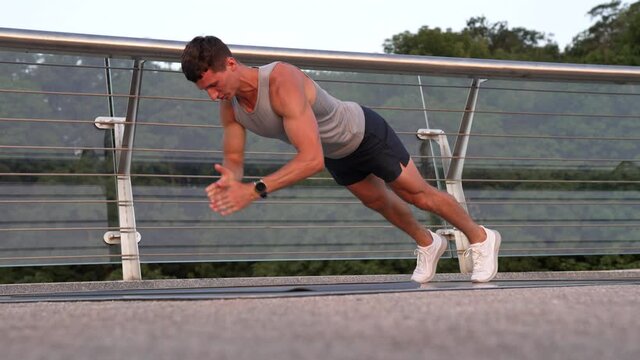 muscular man athlete with fit body do pushups in sporty wear, biceps