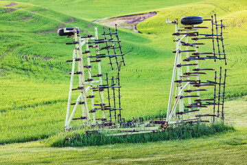 Farm equipment in wheat fields in the Palouse hills.