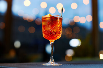 red summer sangria with orange on dark background