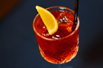 red summer sangria with orange on dark background