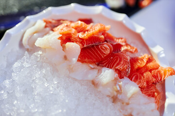 salmon and white fish sashimi on ice