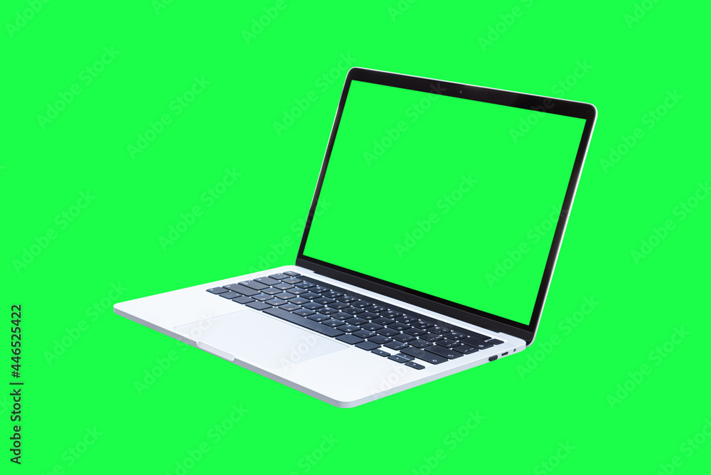 Wall mural laptop computer with blank green screen isolated on green background. object with clipping path.