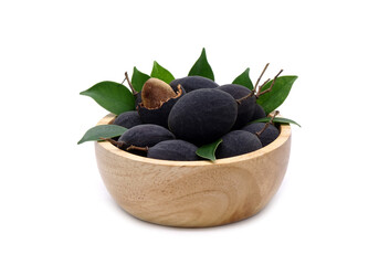 Velvet tamarind in wooden bowl isolated on white background. Black Velvet Tamarind (Dialium cochinchinense)