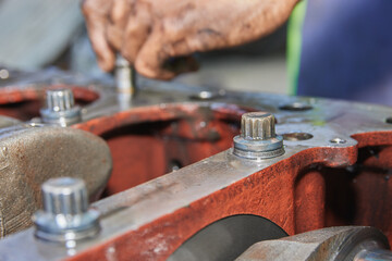 Cylinder Block Bolt and Crankshaft of Car Engine in Car Repair Shop