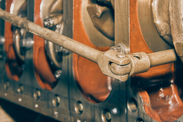 Car Mechanic or Auto Mechanic Use Breaker Bar Loosen Bolt of Crankshaft of Truck Engine in Vintage...