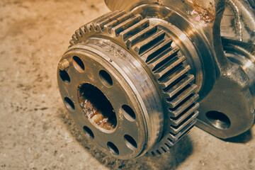 Center Frame Zoom Side View Crankshaft Gear of Truck Engine on Concrete Floor in Vintage Tone