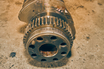 Center Frame Zoom View Crankshaft Gear of Truck Engine on Concrete Floor in Vintage Tone