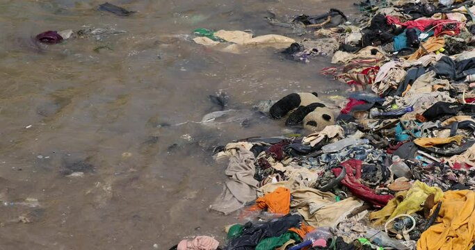 Beach trash Pollution garbage Cape Coast Ghana Africa. Ghana West Africa on  Atlantic ocean. Filthy pollution, trash, garbage and waste wash up on shore. Sandy beaches. Summer vacation destination.