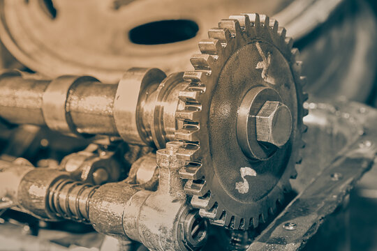 Right Frame Black and White Camshaft Sprocket and Overhead Camshaft and Rocker Arm of Car Engine