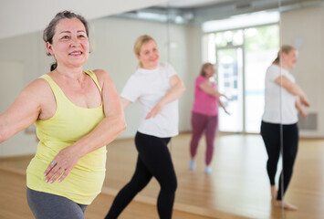 Fototapeta premium European women are dancing during the group training