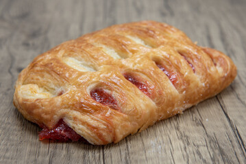 Ham and cheese croissant sandwich is textured with flakey crust for a breakfast treat delight