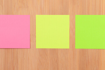 Colored Sticky Notes with Copyspace Pinned to the Wooden Message Board. To Do List Reminder in Office. Blank Memo Sticker at Work - Template. Empty Checklist - Mockup