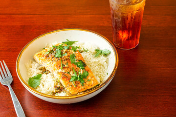 Broiled salmon over rice