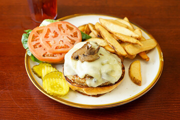 Turkey burger with cheese and mushrooms
