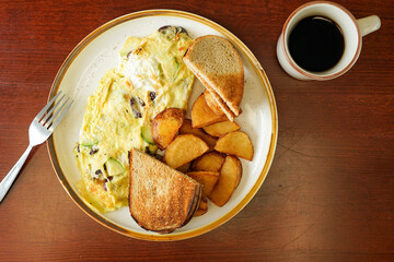 Omelette with toast and potatoes